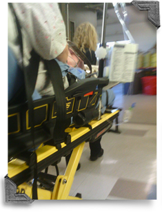 EMS staff wheeling in a patient 