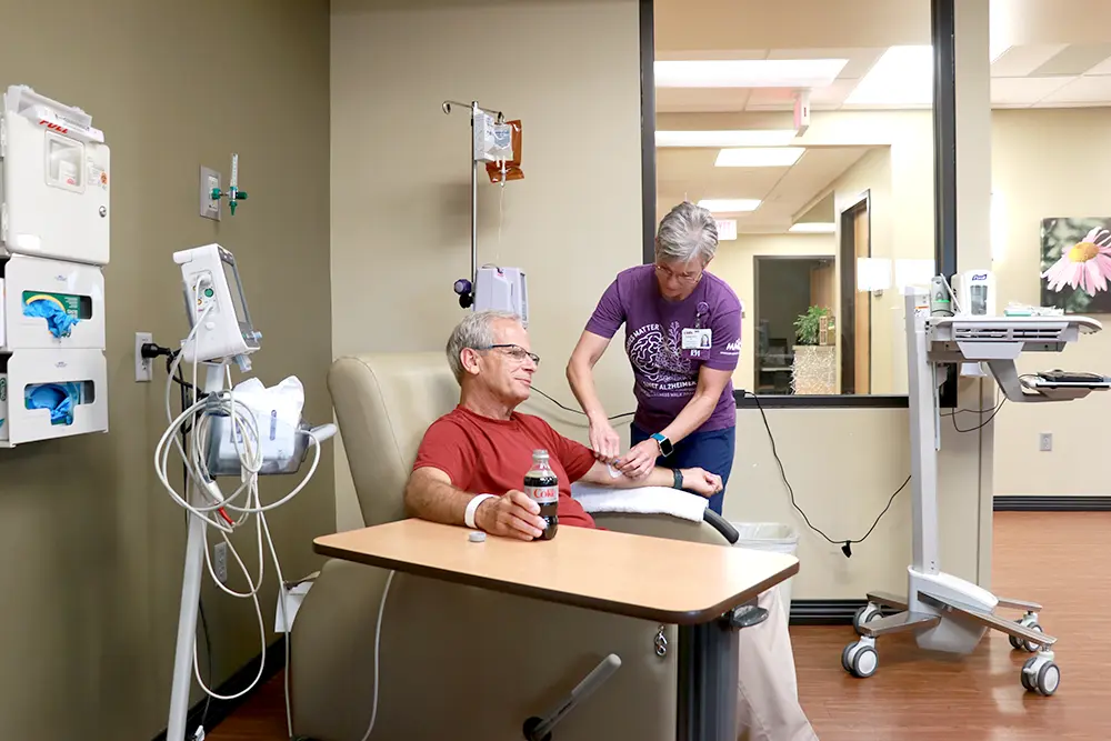 nurse giving an infusion to a patient