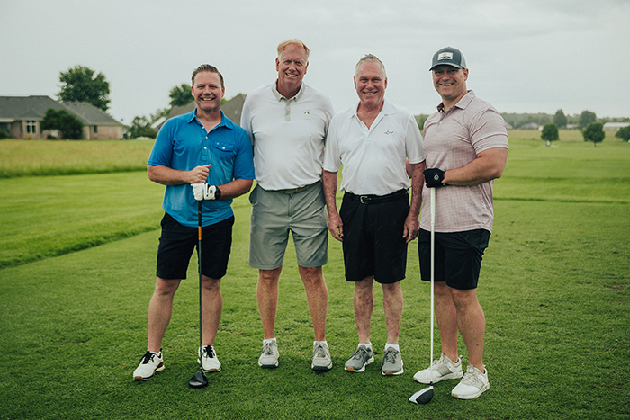 four golfers